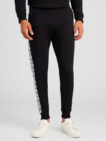 Gianni Kavanagh Tapered Trousers in Black: front