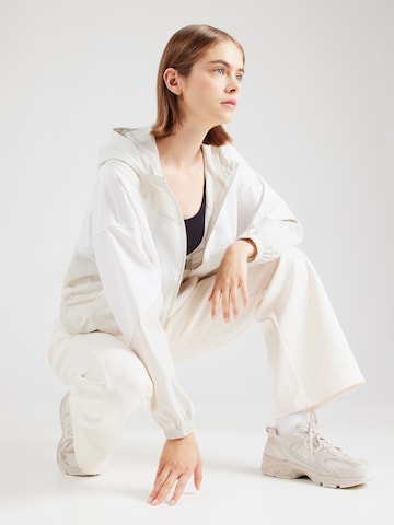 Veste de sport 'Rival' UNDER ARMOUR en blanc