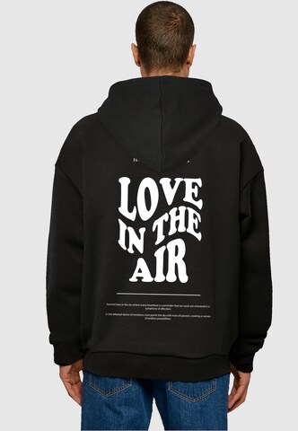 Merchcode Sweatshirt 'Love In The Air' in Schwarz