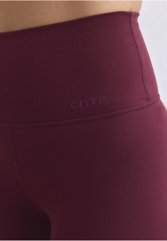 Skinny Pantaloni sportivi 'Sense' di Aim'n in rosso