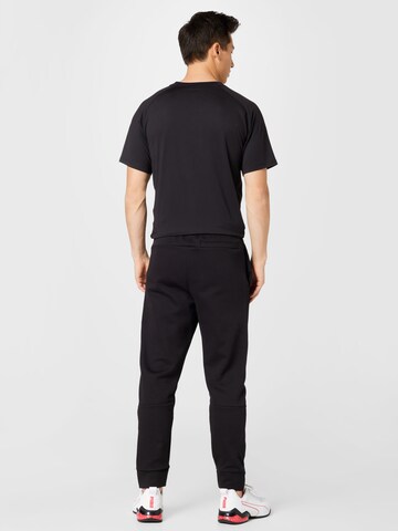 PUMA Tapered Sportbroek in Zwart