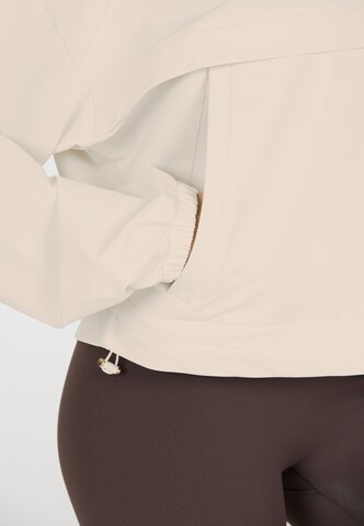 Athlecia Performance shirt 'Carley' in Beige