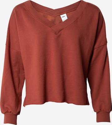 NIKE Sport sweatshirt 'Luxe' i brun: framsida