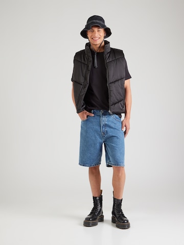 PUMA - Camisa 'Ess' em preto