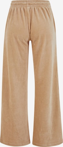 Karl Kani Lużny krój Spodnie w kolorze beżowy