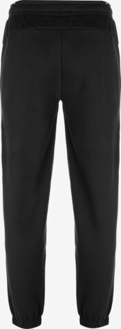 PUMA - Tapered Pantalón deportivo 'Essentials Elevated' en negro