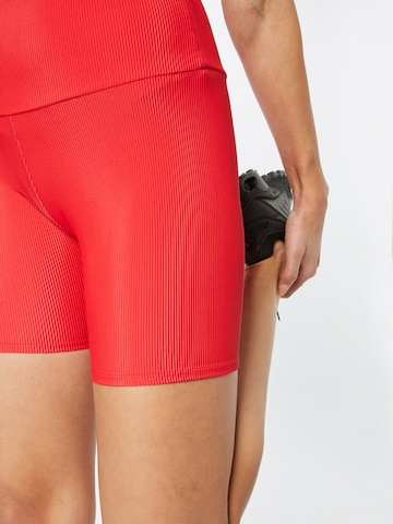 Onzie Skinny Sportbroek in Rood