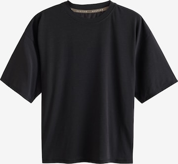 Next T-shirt i svart: framsida