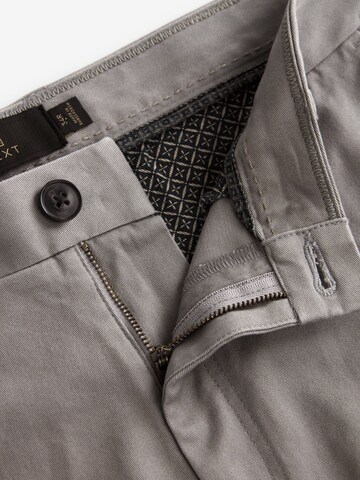 Slimfit Pantaloni chino di Next in grigio