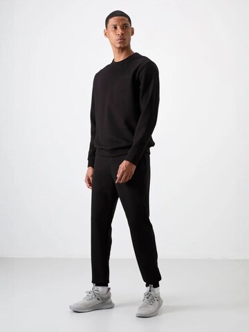 Tommy Life Trainingspak 'Aktive Sets' in Zwart