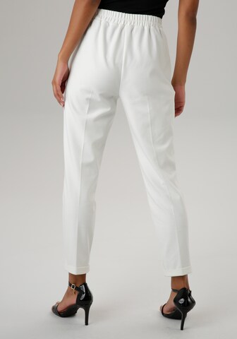Aniston SELECTED Tapered Pleat-Front Pants in White