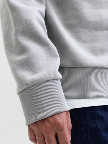 Sweat-shirt 'JJGEPLAS' JACK & JONES en gris
