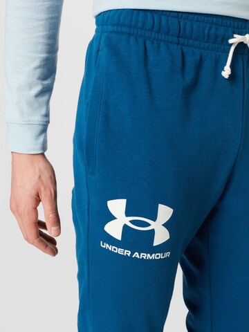 Effilé Pantalon de sport 'Rival' UNDER ARMOUR en bleu