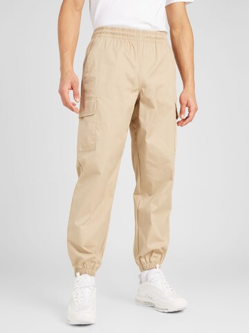 Effilé Pantalon cargo new balance en beige : devant