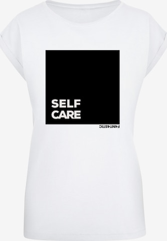 T-shirt 'Self Care' F4NT4STIC en blanc : devant