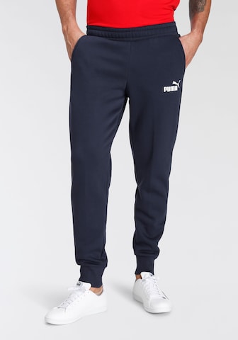 PUMA - Tapered Calças de desporto em azul: frente