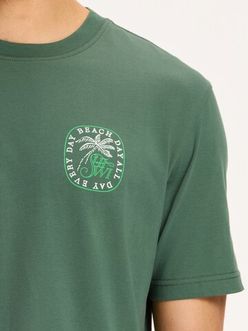 žalia Shiwi Marškinėliai