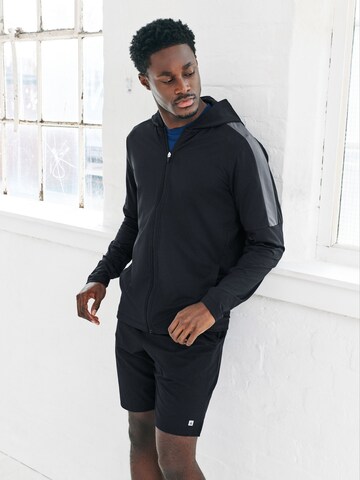 Next Treenitakki värissä musta