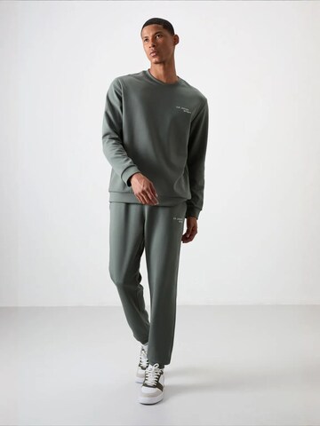 Tommy Life Trainingspak 'Aktive Sets' in Groen: voorkant