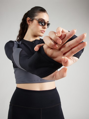 Maglia funzionale di UNDER ARMOUR in nero
