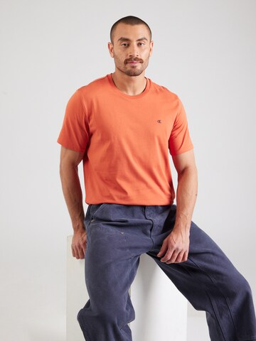 Calvin Klein Jeans Футболка в Оранжевый: спереди