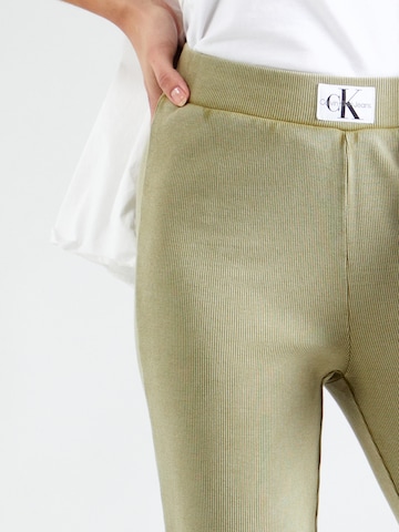 zaļš Calvin Klein Jeans Paplatināti gali Bikses