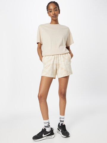regular Pantaloni di Nike Sportswear in beige