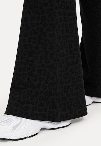 Smilodox Slimfit Schlagleggings ' Lithara ' in Schwarz