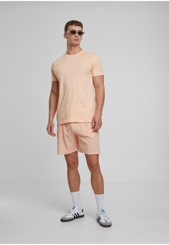 Urban Classics Loose fit Trousers in Orange