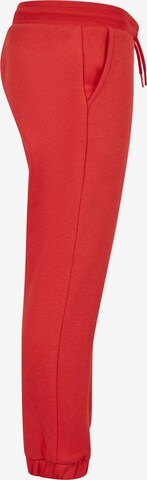 Tapered Pantaloni di Urban Classics in rosso