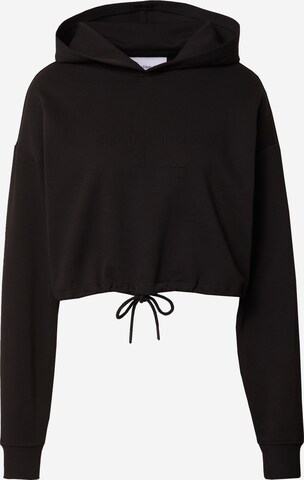 Sweat-shirt Calvin Klein Jeans en noir : devant