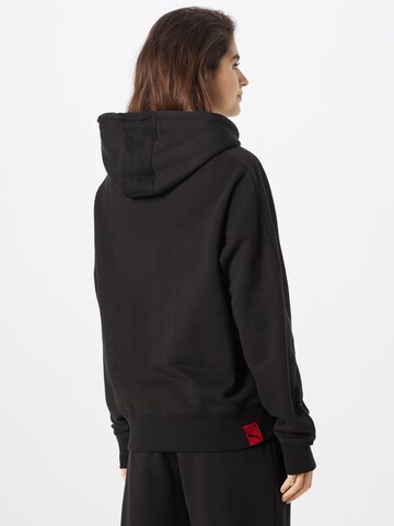 PUMA Sweatshirt 'x Vogue Collection' in Black