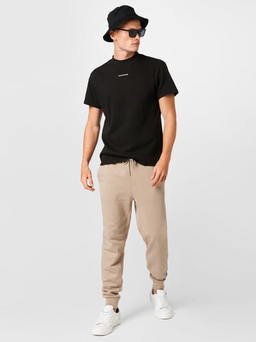 Calvin Klein Jeans Zúžený strih Nohavice - Béžová
