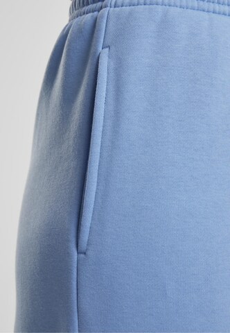 Tapered Pantaloni di Urban Classics in blu