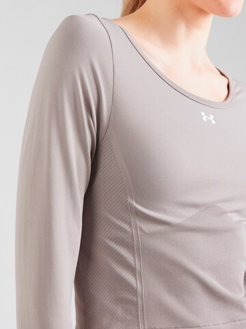 Maglietta di UNDER ARMOUR in grigio