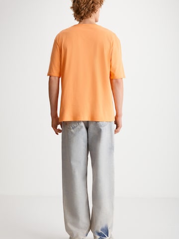 Grimelange T-shirt i orange