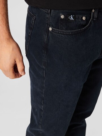 Calvin Klein Jeans Дънки Tapered Leg Дънки в синьо