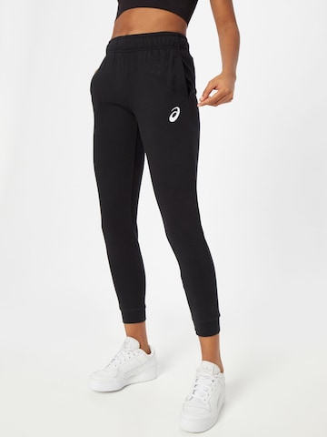 Effilé Pantalon de sport ASICS en noir : devant