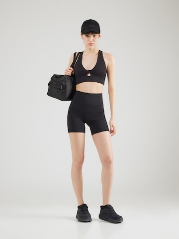 Skinny Pantaloni sport de la Fabletics pe negru