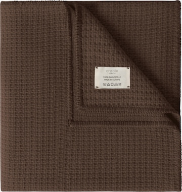 Cradle Studio Blankets in Brown: front