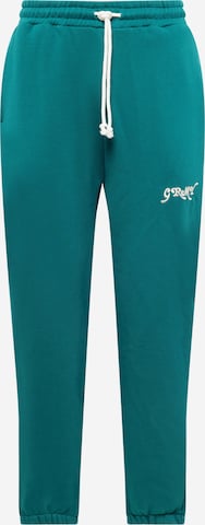 Grimey Tapered Hose 'THE WESTBOUND' in Grün: predná strana