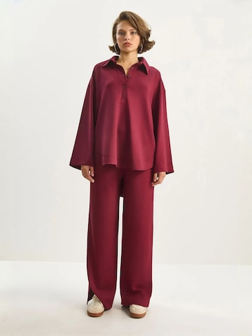 Completo pantalone di Bianco Lucci in rosso