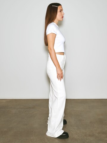 florence by mills exclusive for ABOUT YOU Wide leg Trousers 'Poinsettia' in White