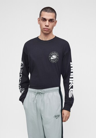 Nike Sportswear Szeroka nogawka Spodnie 'Club' w kolorze szary