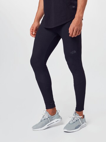 THE NORTH FACE Skinny Workout Pants in Black: front