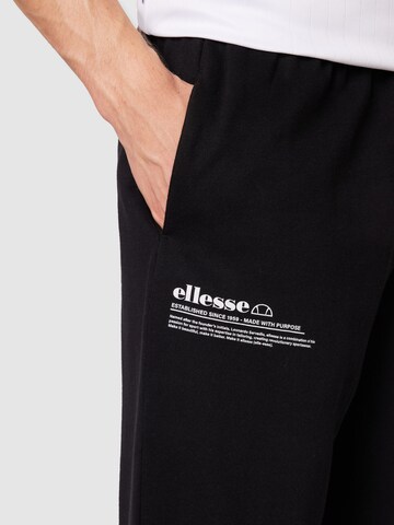 ELLESSE Zwężany krój Spodnie 'Dimartino' w kolorze czarny