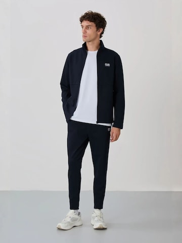 Tommy Life Trainingspak 'Aktive Sets' in Grijs: voorkant