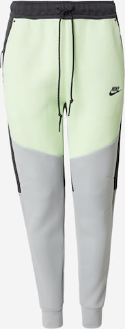 Nike Sportswear Tapered Housut 'TCH FLC' värissä keltainen: etupuoli