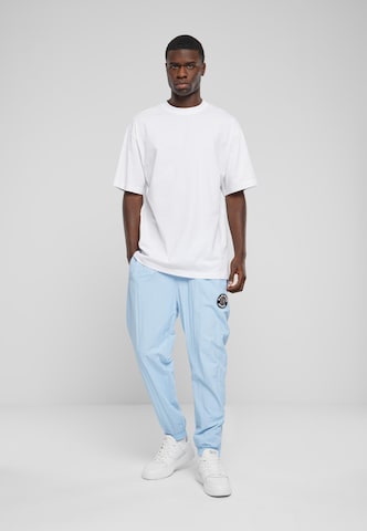 Effilé Pantalon Karl Kani en bleu