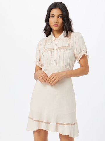 Free People - Vestidos camiseiros em bege: frente